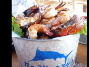 A bucket of grilled seafood